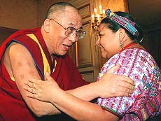 Tibetan spiritual leader Dalai Lama hugs Guatemalan Nobel Peace Prize winner Rigoberta Menchu.