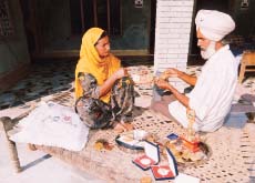 Paramjit's parents proudly display the medals won by him in his eight-year athletic career.