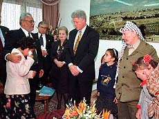 US President Bill Clinton meets crying unidentified daughters of Palestinian prisoners.