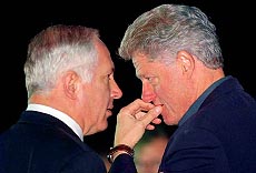 TEL AVIV, ISRAEL : US President Bill Clinton confers with Israeli Prime Minister Benjamin Netanyahu, moments before his departure from the Tel Aviv airport to Washington. President Clinton who wound up a three-day-visit to the Palestinian Authority and Israel failed Tuesday to persuade Israel to resume the West Bank troop withdrawls, but declared the Mideast peace process "back on track". AP/PTI