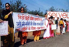 Women employees of insurance corporations display banners while protesting against the IRA Bill on Wednesday at Chandigarh — 