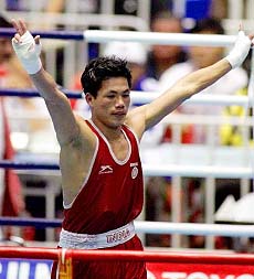 BANGKOK : India's Dingko Singh celebrates his gold medal win in the men's 54Kg boxing at the 13th Asian Games in Bangkok on Thursday. AP/PTI