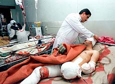 An Iraqi doctor treats a man.