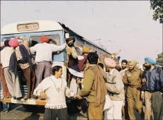 Activists of the karamchari union courting arrest at the Housing board roundabout on Tuesday
