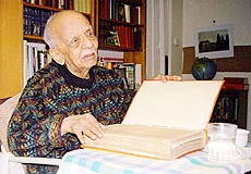OXFORD : Historian Nirad C. Chaudhuri examines a book at his home in Oxford, England, Dec. 14, 1998. AP/PTI