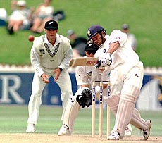  Indian master batsman Tendulkar hits New Zealand medium paced bowler Vettori into the stands for six and completes his seventeenth century in test cricket, during the cricket test in Wellington, New Zealand, on Tuesday — AP/PTI
