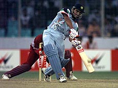 Saurav Ganguly hits a ball for six off West Indies' Keith Arthurton in the second semi-final of the Wills ICC International Cup at the Bangabandhu stadium in Dhaka on Saturday. India scored 242 runs in 50 overs, as Saurav scored 83. AP/PTI