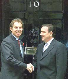 Britain's Prime Minister Tony Blair (left) greets German Chancellor Gerhard Schroeder