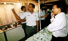 An entrepreneur makes enquiries at the display counter of 7 Base Repair Depot at Air '98 show in Chandigarh on Monday 
