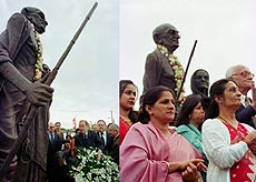 (Left) Portuguese President Jorge Sampaio lays a wreath at the statues of Mahatma Gandhi and his wife, Kasturba Gandhi, unveiled before the opening of a Hindu temple. (Right) Indian community at the inauguration in Lisbon on Wednesday.