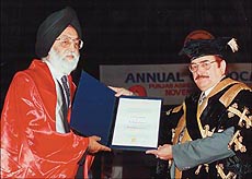 Chief Election Commissioner M. S. Gill being conferred with degree of Doctor of Science by the Chancellor, Lt-Gen B. K. N. Chhibber, at Punjab Agricultural University's convocation in Ludhiana