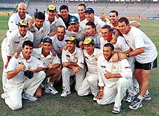 LAHORE, PAKISTAN : Australian cricket team pose for photographers after their victory in one-day cricket match series against Pakistan at Ghaddafi stadium in Lahore on Tuesday