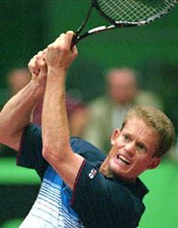 Wayne Ferreira of South Africa returns a backhand to second-seeded Patrick Rafter of Australia