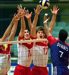 KADOMA : Spanish players (from left) Miguel Angel Falasca, Jose Luis Molto and Enrique de la Fuente, jump together to block a spike from Cuba's Angel Dennis Diaz (right) during their quarter-final round match of the Men's Volleyball World Championships in Kadoma, western Japan, on Wednesday. Cuba won the match 15-4, 15-5, 7-15, 15-12. AP/PTI