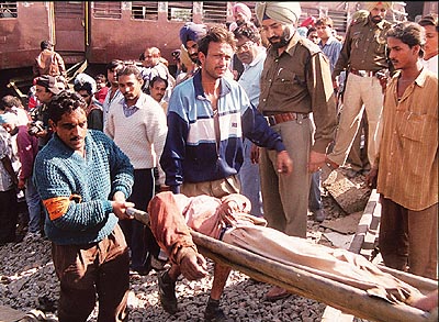 An injured passenger being taken out of the train
