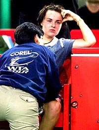 MUNICH, GERMANY : Swiss player Martina Hingis gets a therapy on her leg during their semi-final match vs. Swiss Patty Schnyder at the tennis Compaq Grand Slam tournament in the Munich olympic hall on Friday. Hingis cancelled the match in the third set caused by an injury. AP/PTI