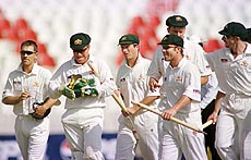 RAWALPINDI : Australian players (from left) Justin Langer, Ian Healy, Steve Waugh, Glen Mcgrath (background) , Michael Slater and Damien Fleming walk off the field after defeating Pakistan by an inning and 99 runs in the first Test at Rawalpindi stadium on Monday. AP/PTI