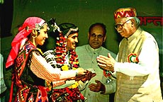 Union Home Minister L. K. Advani and Himachal Chief Minister P. K. Dhumal with folk dancers at the closing ceremony of the Kulu Dasehra on Wednesday. — PTI photo