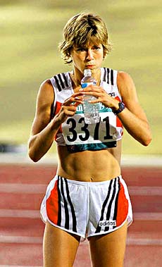 FILE PHOTO -- Germany's Uta Pippig takes some water before the women's marathon at the 1996 Summer Olympics in Atlanta, July 28, 1996. The german born marathon ace Pippig was banned under suspicion of doping by the German track and field federation on Wednesday, a German sports agency reported. AP/PTI
