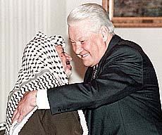 Russian President Boris Yeltsin, embraces Palestinian leader Yasser Arafat during their meeting in the Kremlin, Moscow, on Thursday. 