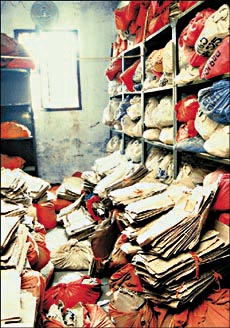 Files lie dumped in the record room. Photo by Gautam Singh