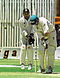 Zimbabwe batsman Craig Evans falls LBW to the bowling of Anil Kumble for 4 runs as India's Nayan Mongia celebrates behind the stumps