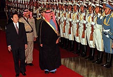 BEIJING : Crown Prince Abdullah of Saudi Arabia is accompanied by Chinese Premier Zhu Rongji, reviews troops during a welcome ceremony in Beijing on Wednesday. AP/PTI