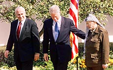 President Clinton leads Palestinian leader Yasser Arafat (right) and Israeli Prime Minister Benjamin Netanyahu to the Cabinet Room of the White House