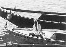 A boatman caught in a reflective mood as he waits for passengers near a ghat in Varanasi. Photo by the writer