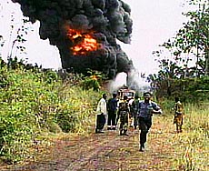 Firefighters struggling to control a blaze in Jesse in the oil-producing area of southern Nigeria on Monday. 