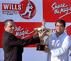 DHAKA : ICC president Jagmohan Dal Mia (left) hands over the Wills Cup Trophy to Bangladesh Cricket Control Board President Saber Hossain Chowdhury at Bangabondhu National Stadium in Dhaka on Friday — AP/PTI