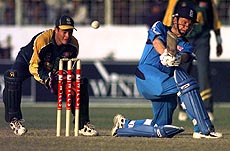 DHAKA : Neil Fairbrother sweeps a ball for 4 runs as England made 281 for 7 in their stipulated 50 overs against South Africa in the second day of the Wills ICC Cricket Tournament in Dhaka, Bangladesh on Sunday. — AP/PTI