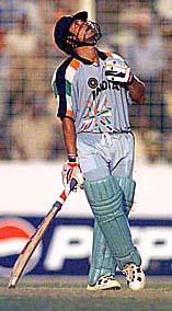 DHAKA : Indian batsman Sachin Tendulkar looks skywards after scoring a fine century as he went on to make 141 runs in their Wills International Cup one-day match against Australia at the Bangabandhu stadium in Dhaka on Wednesday. AP/PTI