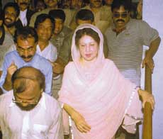 DHAKA: Bangladesh former Prime Minister Khaleda Zia and her party supporters walk out of a court room after the court granted her bail in one of the two corruption cases filed by the current government against her in Dhaka on Sunday. Khaleda Zia, the leader of the main opposition Bangladesh Nationalist Party, has been accused of misusing government funds to furnish her house when she was in power.