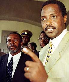 Vice-President of the Congolese rebel movement Arthur Ngoma listens as rebel spokesman and former Foreign Minister of the Democratic Republic of Congo Bizima Karaha speaks to journalists.