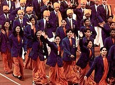 KUALA LUMPUR: Members of the India delegation to the 16th Commonwealth Games wave during opening ceremonies at Bukit Jalil National Sports Stadium in Kuala Lumpur on Friday. AP/PTI