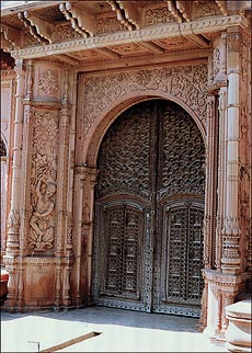 A rare, intricate aterna form of door fixed under the porch of Chaudhari Chhaju Rams haveli at Alakhpura village, Bhiwani.