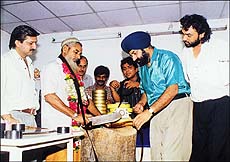 Shah Navaz, a butcher, performing the "negative cutting ceremony" of comedian Japsal Bhatti's forthcoming film,"Mahaul Theek Hai" at Mumbai on Sunday
