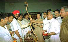 Congress president Sonia Gandhi with bows and arrows presented to her