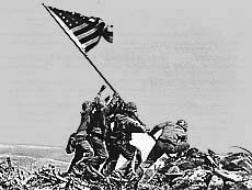 Iwo Jima, Volcano Islands, Feb. 23, 1945 — U.S. Marines raise the flag atop Mount suribachi on the Pacific island in World War II. Photo: Joe Rosenthal (Pulitzer Prize.)