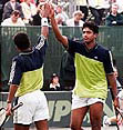 Bhupathi-Paes pair celebrate after their 7-6(7-2), 3-6 7-6 (7-3) victory over the British pair at Notingham Tennis Centre on Saturday.— AP/PTI