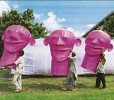 'Heads' of Ravana, Kumbhkarna and Meghnatha being carried by artists for giving final touches to the effigies as part of Dasehra preparations in Sector 17 in Chandigarh on Sunday.