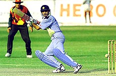 Indian batsman Saurav Ganguly looks back at a cut to fine leg on Sunday in Buluwayo. Ganguly went on to score 107 runs not out in his team's 8 wicket victory over Zimbabwe in the second one day international.AP/PTI