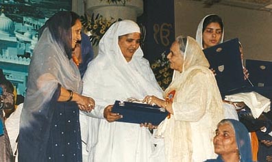 Mrs Inderjit Kaur, a former Vice-Chancellor of Punjabi University, Patiala, being honoured at the Mata Sahib Kaur Istri Sammelan on April 11, 1999 at Anandpur Sahib.