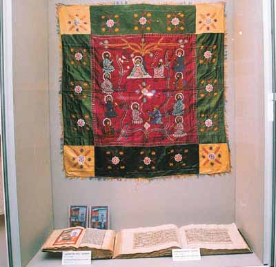 Important artefacts displayed at the exhibition. Historical manuscripts can be seen in the foreground