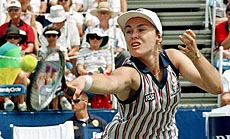 Martina Hingis of Switzerland returns a volley during the quarter final match against Conchita Martinez of Spain 