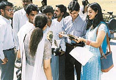 Students share their joy after receiving prizes at a function held to honour toppers at Panjab University on Sunday 