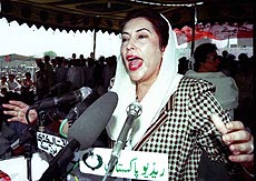 Ms Benazir Bhutto addresses supporters at the grave of her father.