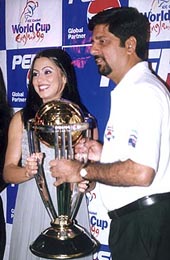 Film actress Mahima Chaudhary and former India opener K. Srikkanth with the replica of the World Cup in New Delhi on Monday