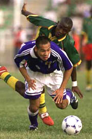 Cameroon's Clement Lebe, rear, and Japan's Naohiro Takahara battle for the ball during the second half play of the Under-20 World Youth Soccer Championships in Kano, Nigeria Monday April 5, 1999. 